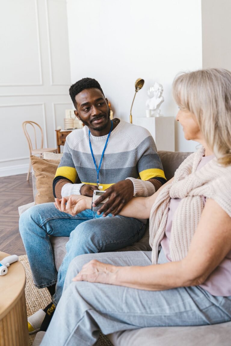 Caregiver supporting a senior client during a home visit on the South Shore